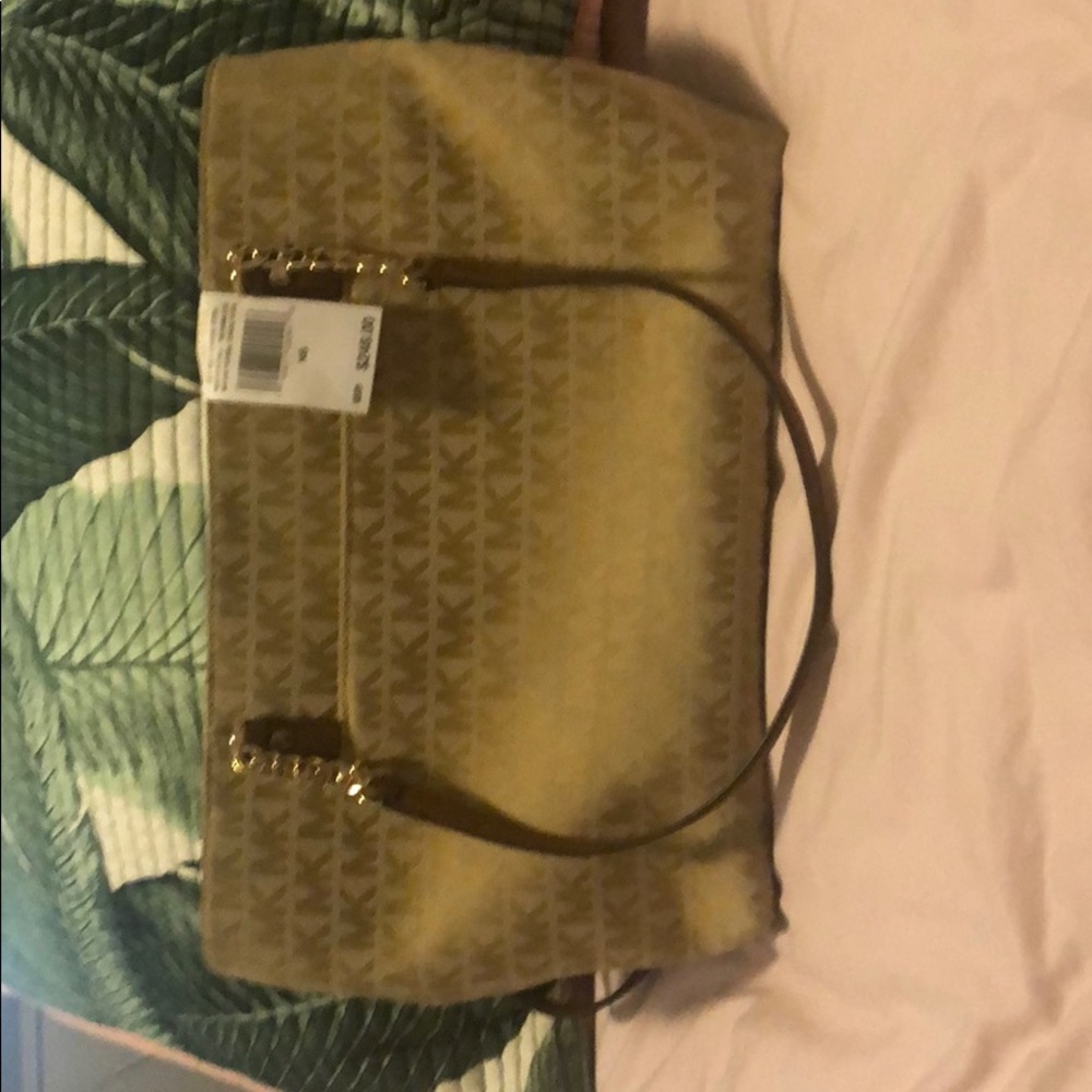 Michael Kors purse Retail at $248 and askin $160.